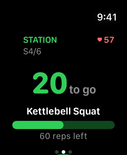 Apple Watch during a station: the STATION badge, 20 reps to go, and heart rate 57.